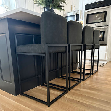 Shop the stylish Black PU Leather Bar Stools for a modern touch of comfort in your kitchen or bar area!